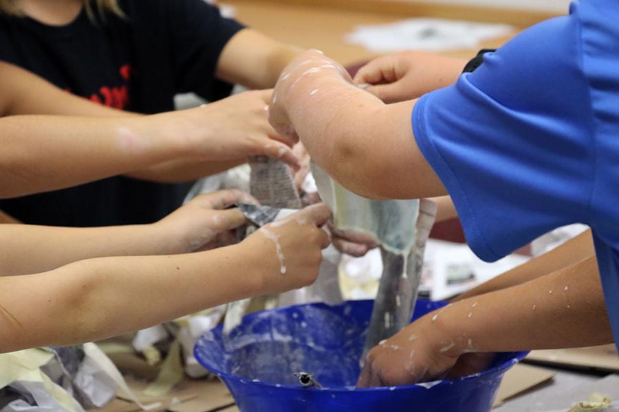 Group of students playing with slime.